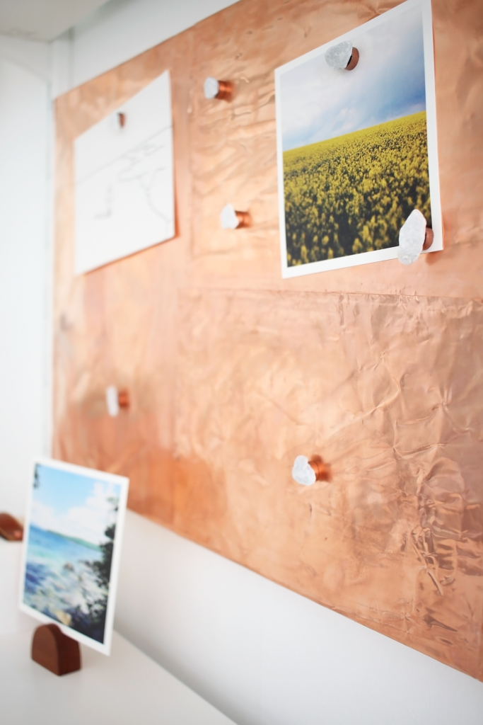 Love this Scandinavian workspace makeover with white open shelves, plenty of storage for craft supplies, and a gorgeous DIY copper inspiration board.