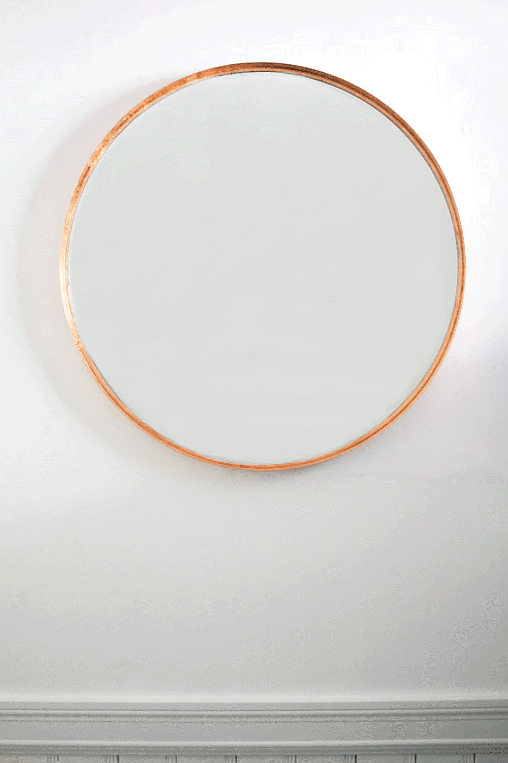 You can turn any plain mirror into a DIY copper mirror on a budget using just copper leaf and a paintbrush. The perfect inexpensive craft for a high-end look!