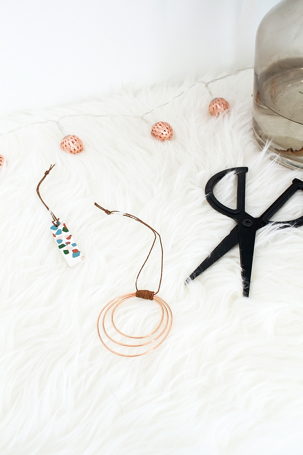 Add a little boho bling to your holiday decor with these easy DIY Copper Wire Hoop Ornaments that take just ten minutes to make!