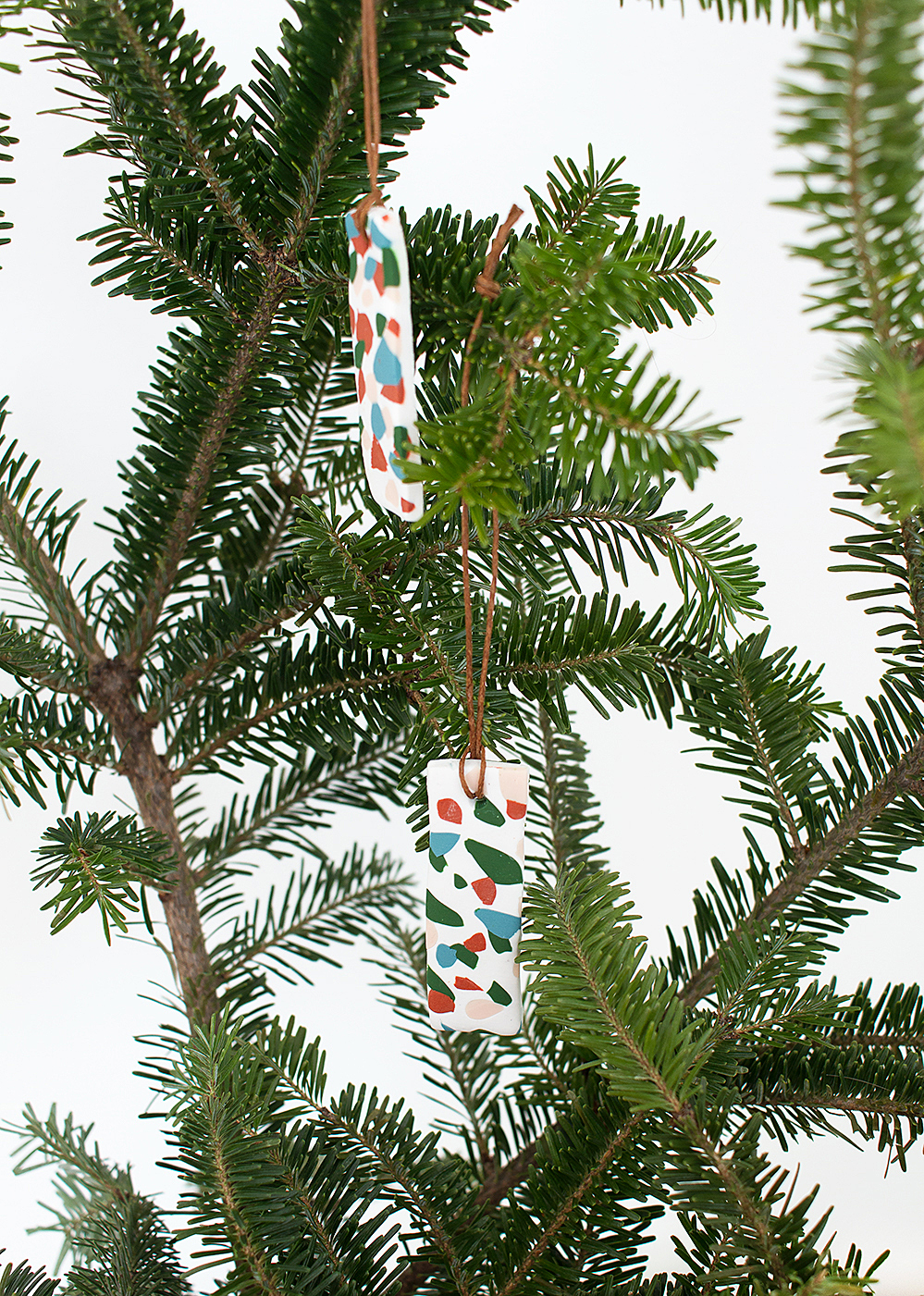 Make these easy and fun DIY terrazzo tile ornaments for a modern, colorful addition to your holiday decor.