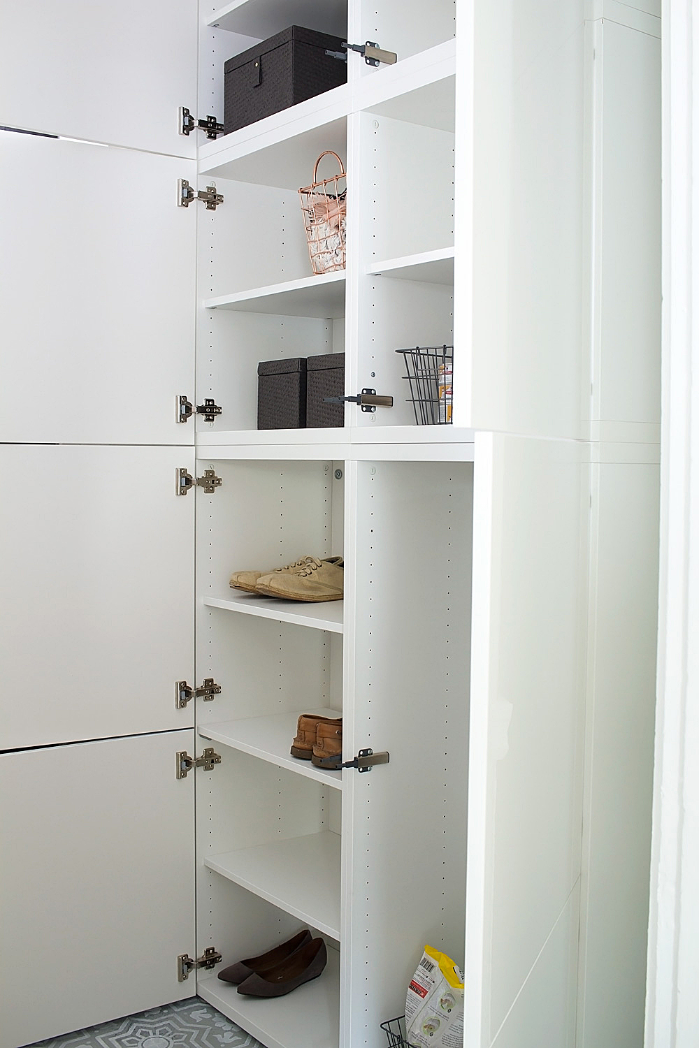 How to use IKEA BESTA cabinets to completely transform your entryway into a practical, organized, and inviting space.